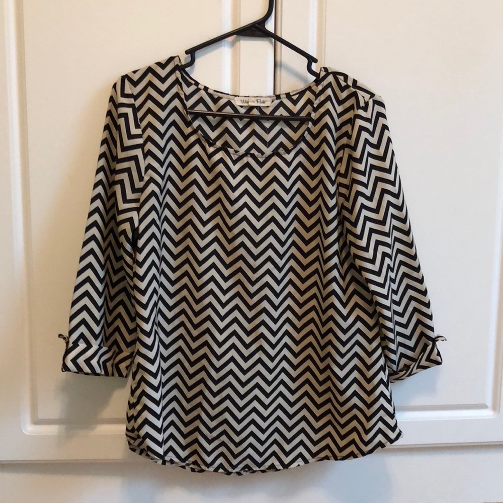 Black and white shirt with gold buttons on sleeves